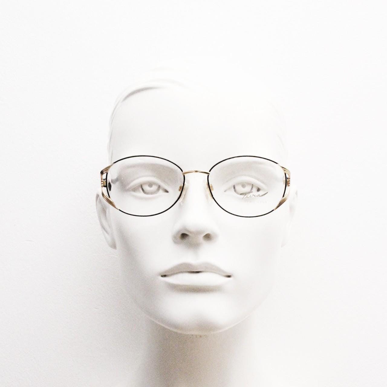 Tura 80s vintage oval eye glasses made in Italy. Womens black and gold optical frame with Y forked temples. Prescription RX. Unused NOS