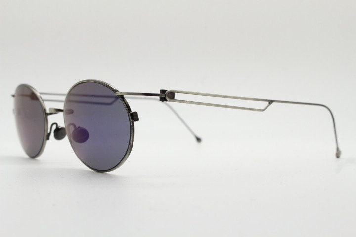 90s vintage oval sunglasses. Refined 'industrial tech' style brushed bronze metal frame with cool blue mirror lenses. Unused NOS