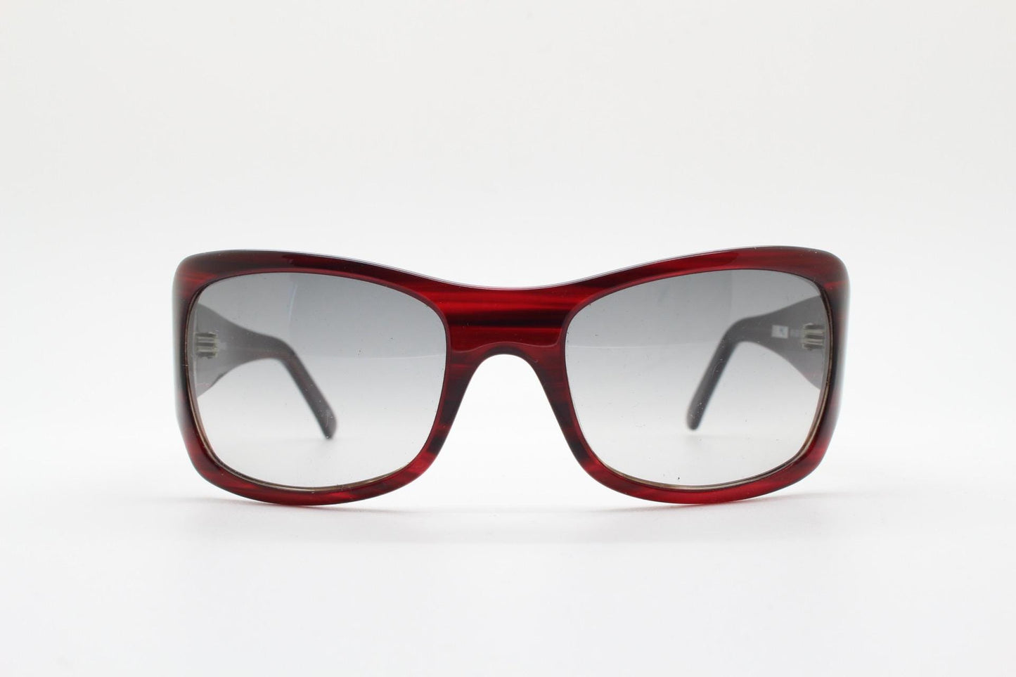 Y2k vintage wrap around large bug eye sunglasses. Curved red acetate shield frame with light tone lenses. 1960s bug eye design. 2000's NOS