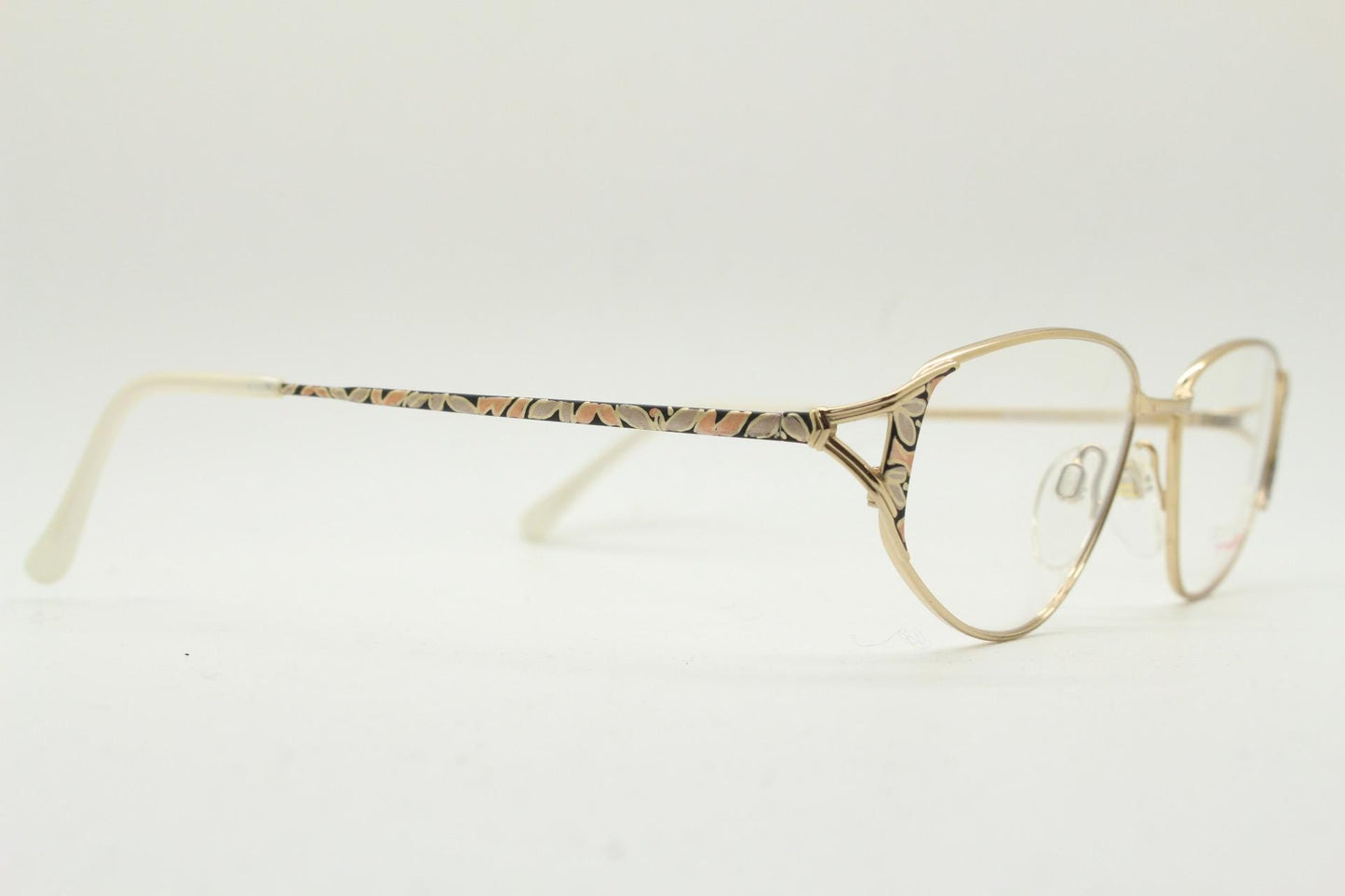 Eschenbach 90s vintage cropped cat eye glasses. Low profile gold metal optical frame with tasteful metallic arm pattern. Prescription. NOS