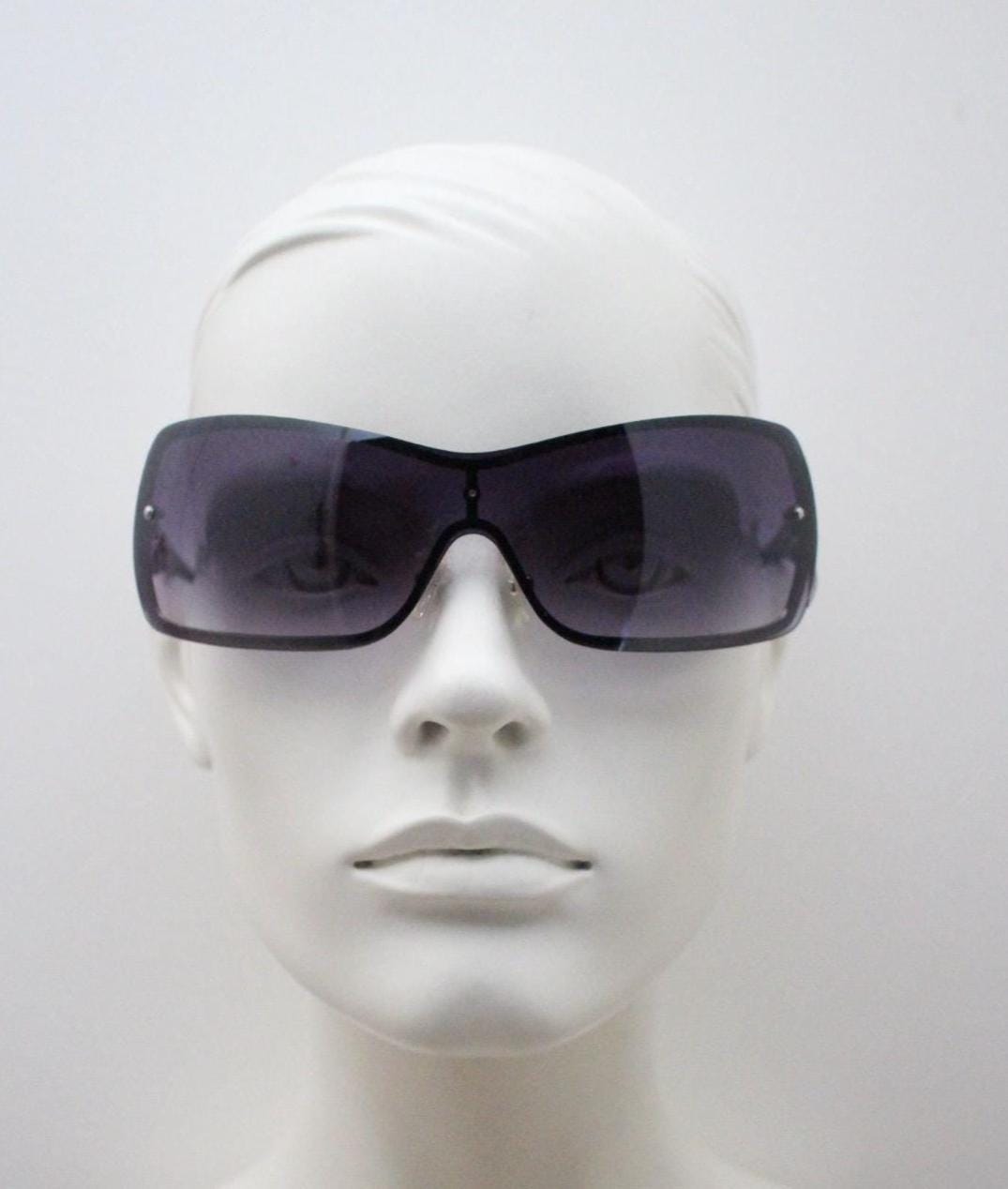 Y2K vintage visor sunglasses. 2000's grey wraparound mono lens mini mask shield design with stupendous lattice arms. Bug eye. Unworn NOS