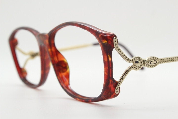 Christian Dior 80s vintage rectangular eye glasses made in Germany from Optyl. Striking marbled amber acetate optical frame. Prescription RX