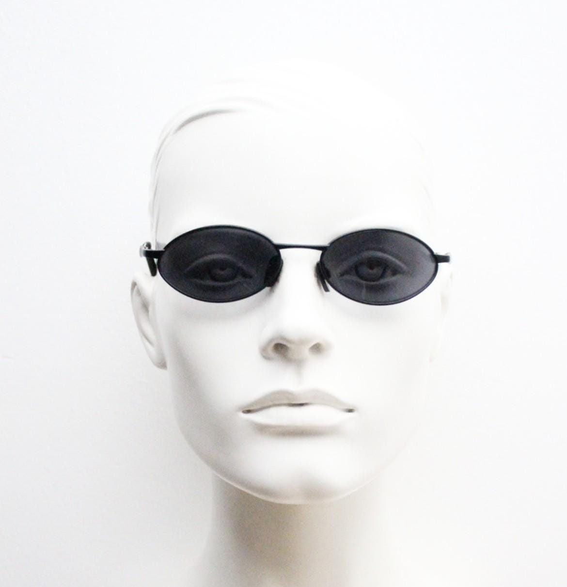 90s vintage small oval bug eye sunglasses. All black matt finish frame. Classic Matrix shape. Cosplay. Unworn NOS