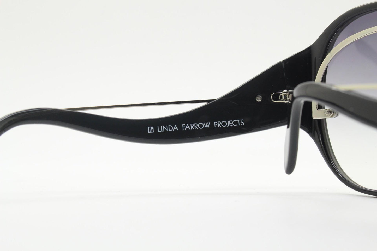 Jens Laugesen oversized sunglasses hand made by Linda Farrow. Black frame with undulating arms and smoky lenses. 70s design. Vintage. NOS