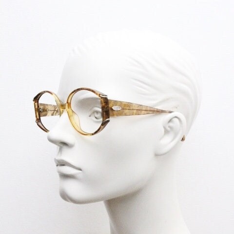 Christian Dior 70s vintage round eye glasses. Transparent honey colour optical frame with abstract gold sparkle patterns. Prescription RX