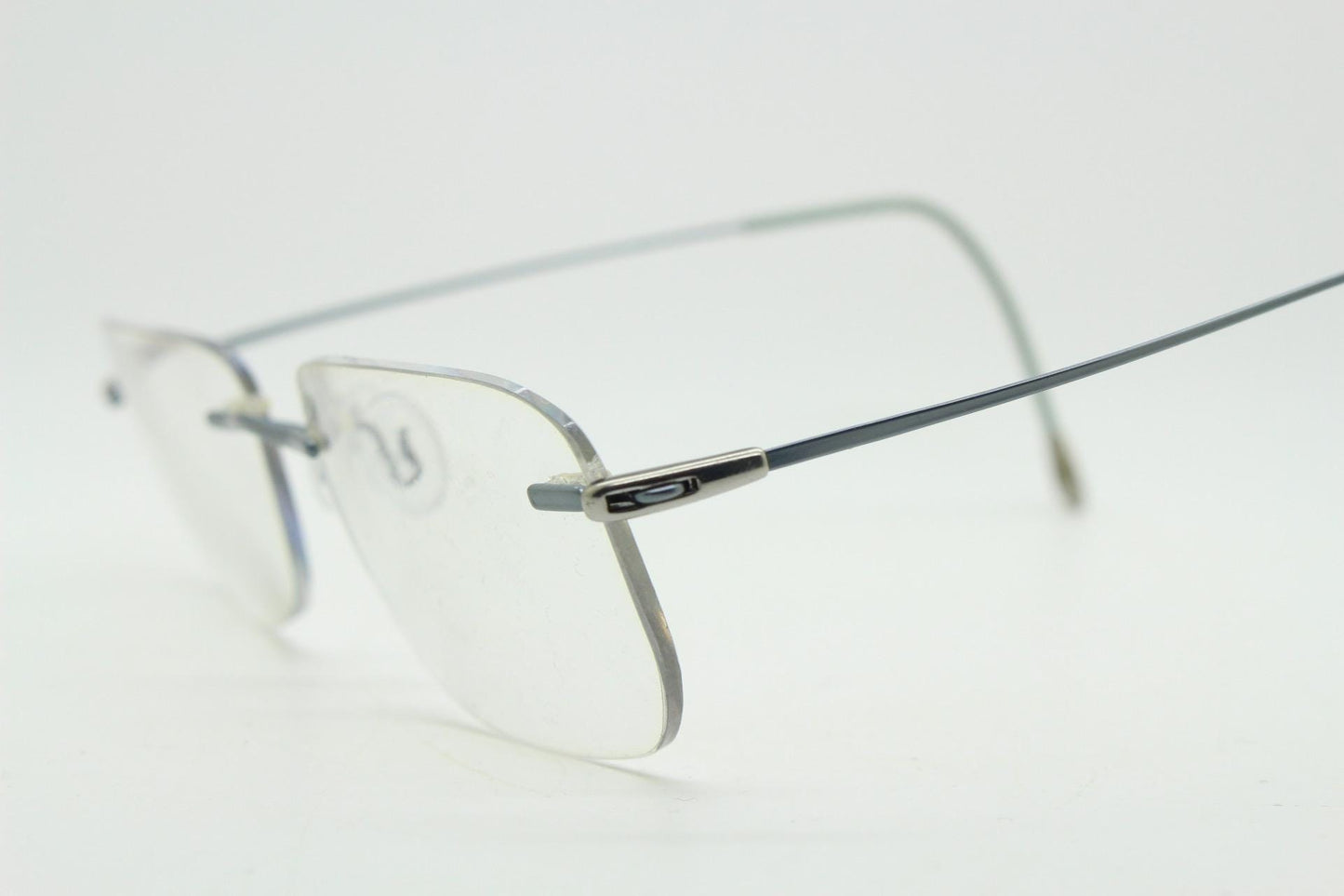 Silhouette rectangular frameless eye glasses model 7554 made in Austria. Minimal lightweight titanium optical frame. Prescription RX