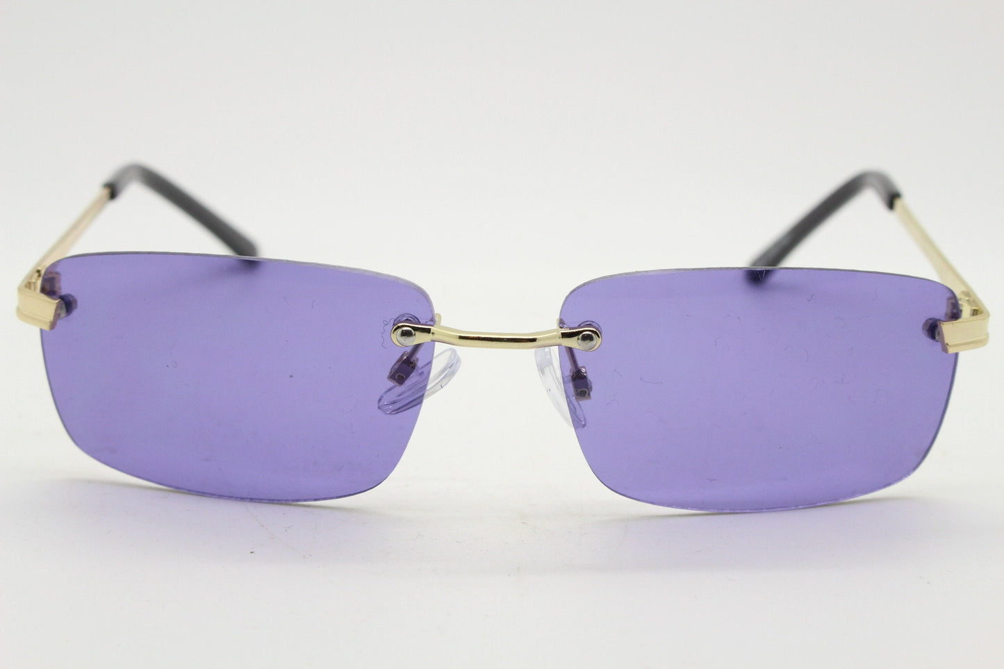 Y2K vintage frameless purple sunglasses. Rectangular lenses with gold bridge and arms. 2000s club kids. 00's. 90s Rave