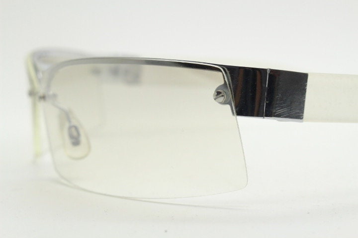 Y2K vintage wraparound sunglasses. Sick fashion grail half frame in silver chrome with extra light tone curving mirrored lenses. 2000's NOS
