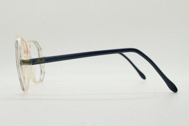Silhouette 80s vintage hexagon eye glasses made in Austria. Transparent crystal optical frame with abstract blue pattern. Prescription. 70s