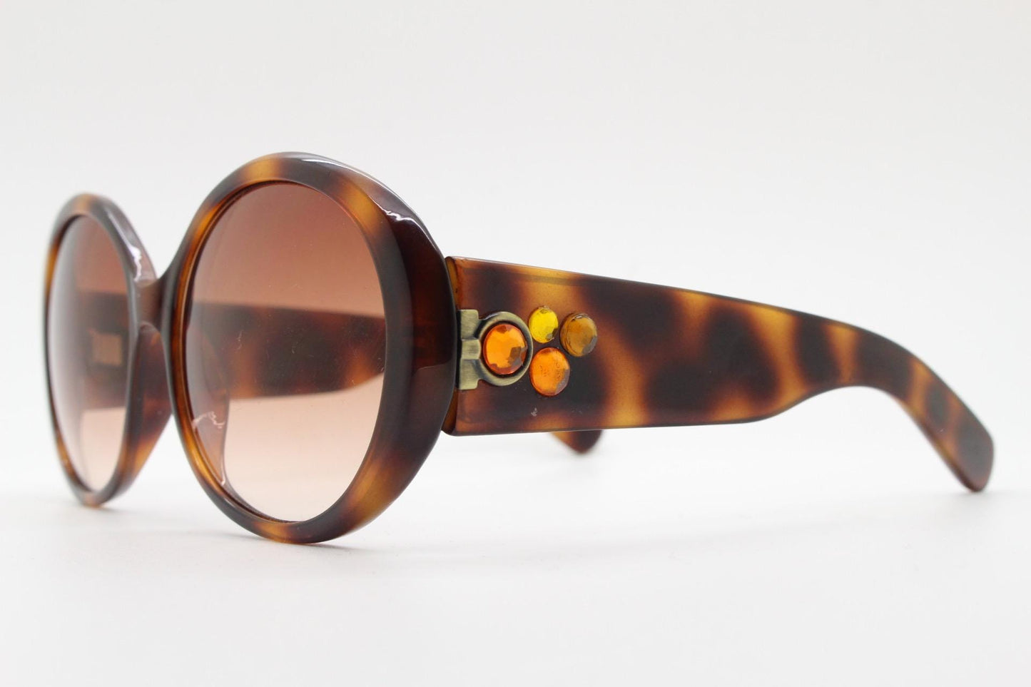 90s vintage round sunglasses. 60s style thick honey tortoise frame with graduating lenses and amber diamantes. Rhinestone. Unused NOS
