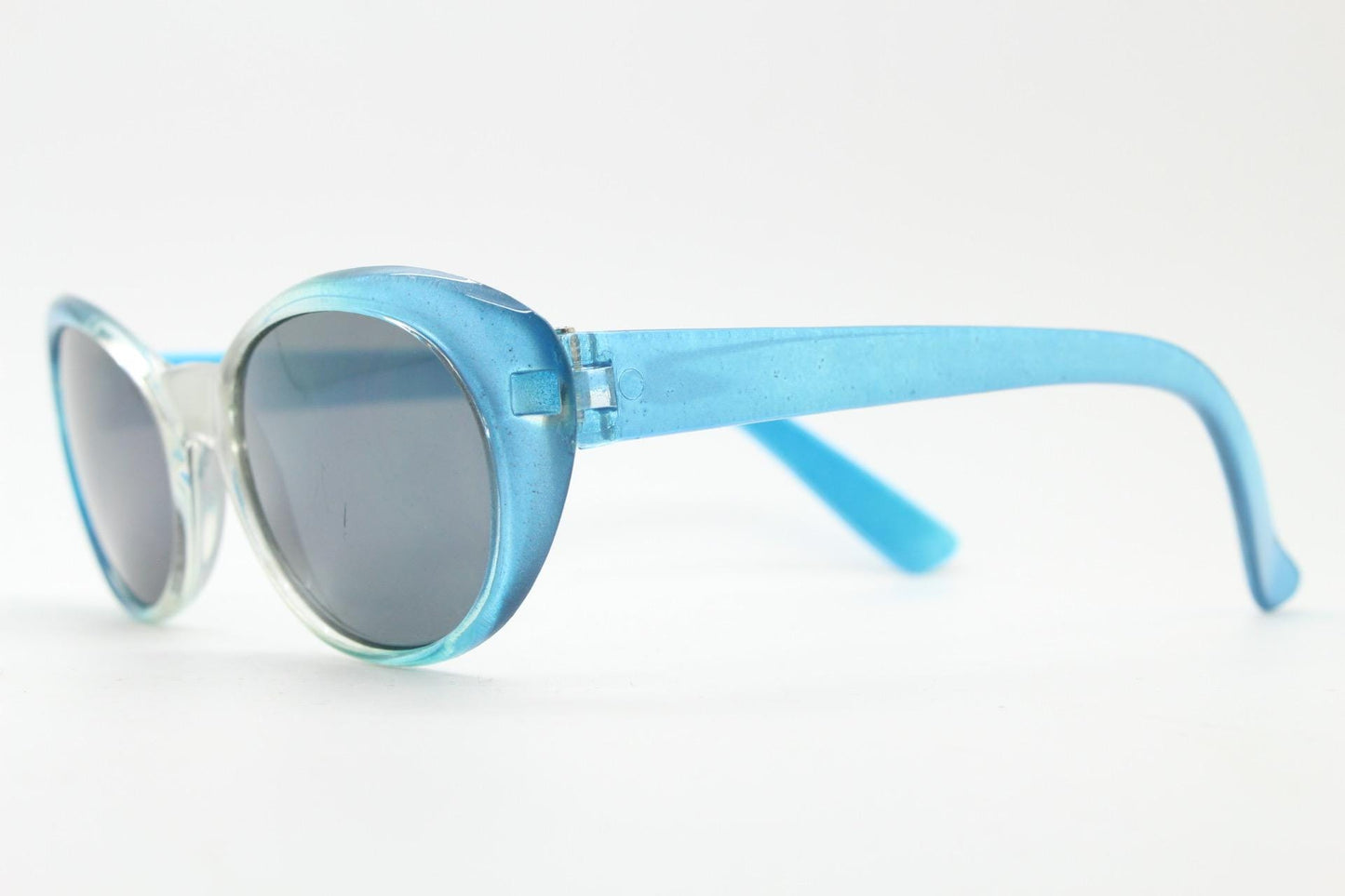 90s vintage oval cat eye sunglasses. Womens pearlised silver to aqua blue ombre fade cateye frame with contrasting dark lenses