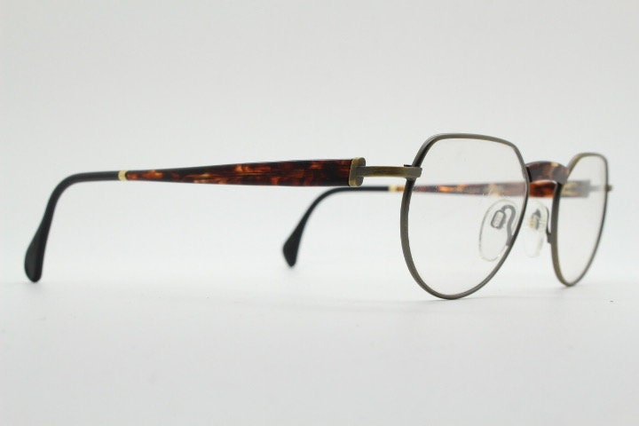 Silhouette vintage 90s flat top oval eye glasses made in Austria. Satin bronze optical frame with honey tortoise trim. Prescription RX
