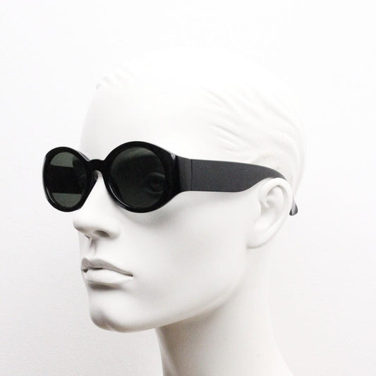 Y2k vintage tall arm oval sunglasses. 60s design black frame with curved sides and green lenses. Unused NOS. Mod. Beatnik