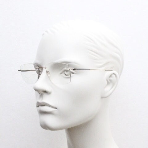 Silhouette rectangular frameless eye glasses model 7719 made in Austria. Minimal lightweight titanium optical frame. Prescription RX