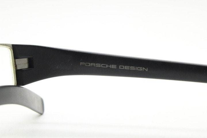 Porsche design rectangular eye glasses. Minimal grey metal optical frame in a matt finish with black arms. Vintage Prescription spectacles