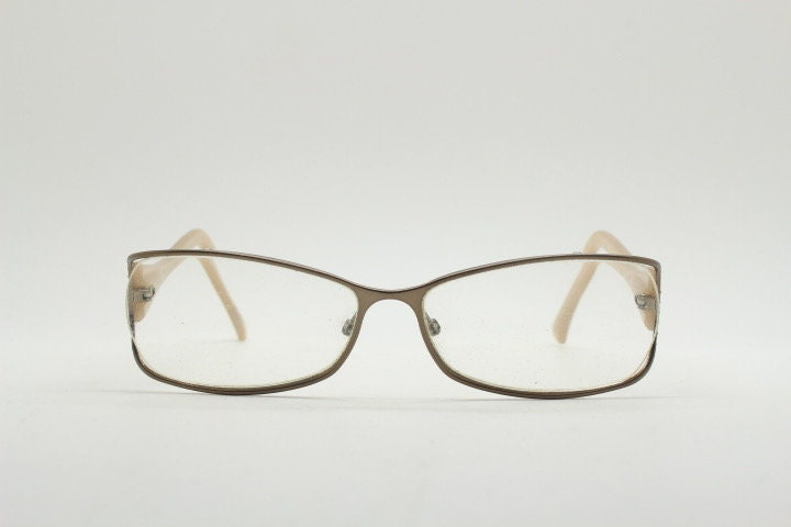 Givenchy eye glasses in brown chrome with beige acetate arms and gold diamante detail. Rhinestone optical frames. Prescription eyeglasses RX