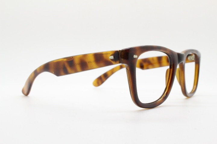 90s vintage wayfarer design eye glasses made in Italy. All time classic optical frames in mottled browns. Prescription RX eyeglasses. NOS