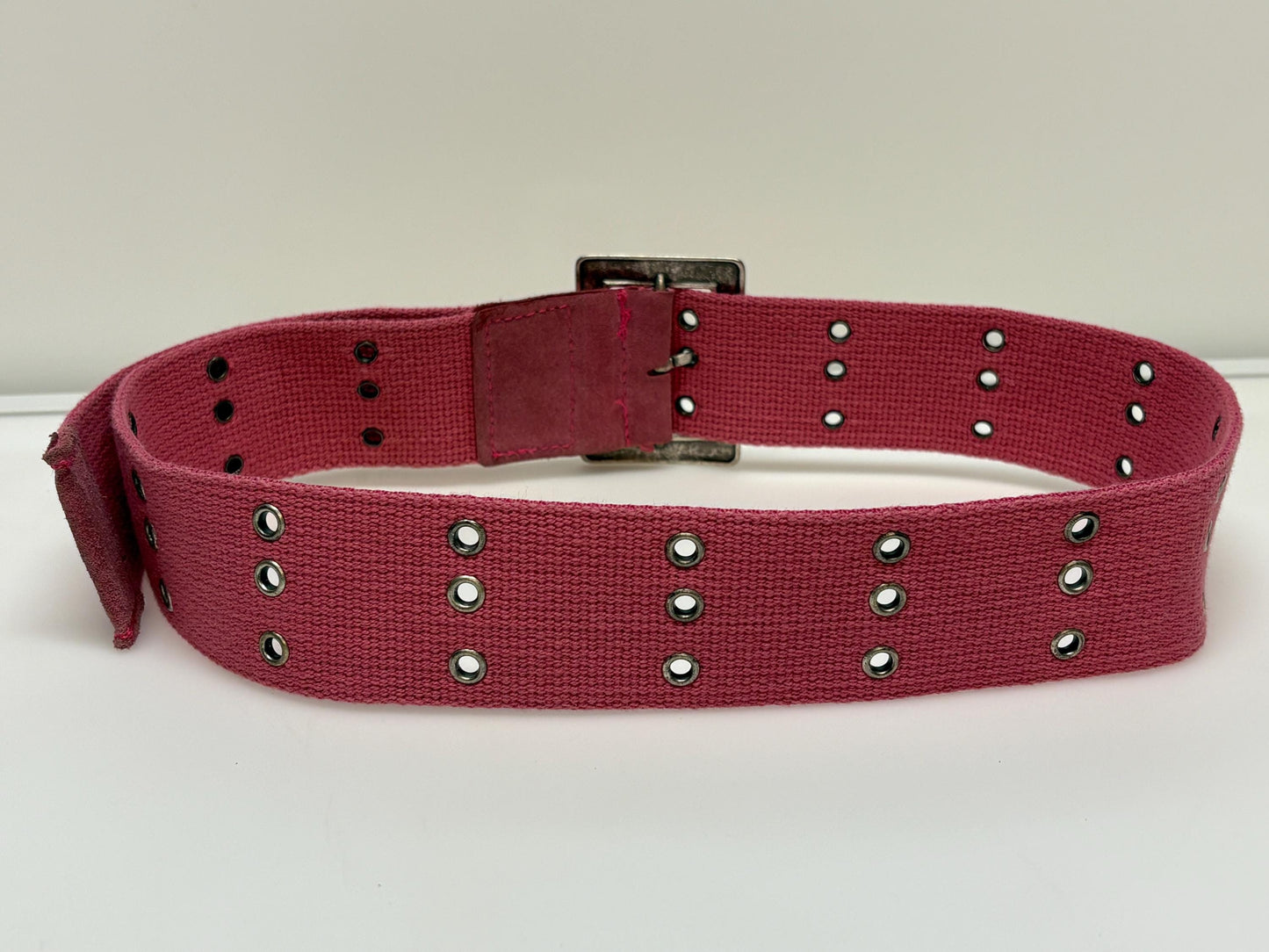 Y2k vintage thick candy pink army style belt with distressed metal buckle and 3 rows of lace holes. Statement feature / to cinch a dress