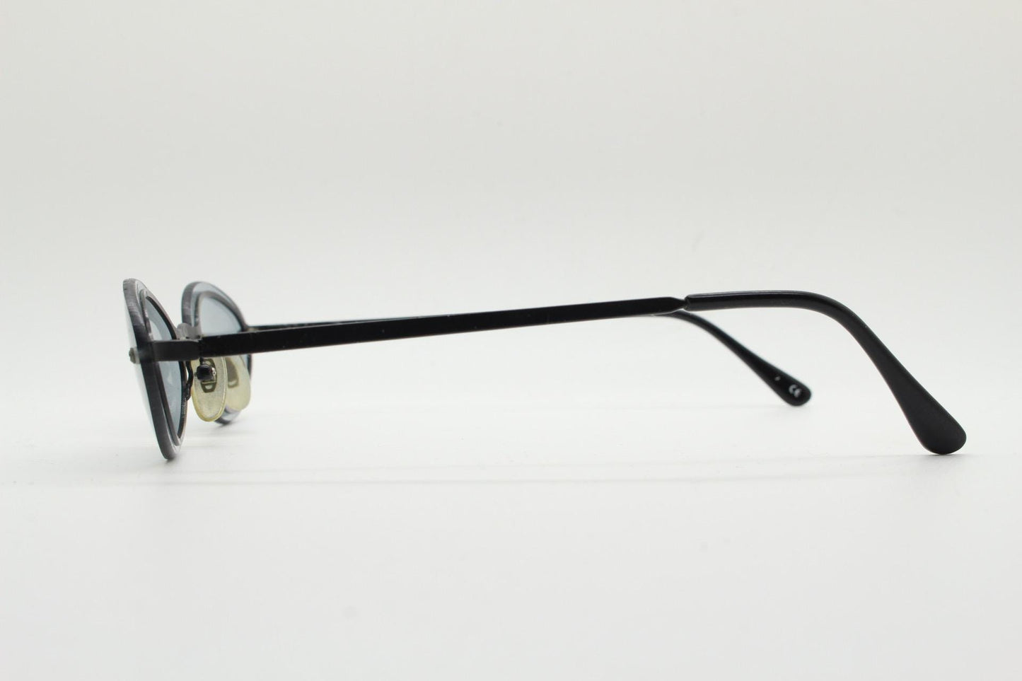 90s vintage small oval sunglasses. Minimal black metal frame with clever overlapping lens design in light tone grey. Micro. Steampunk. NOS