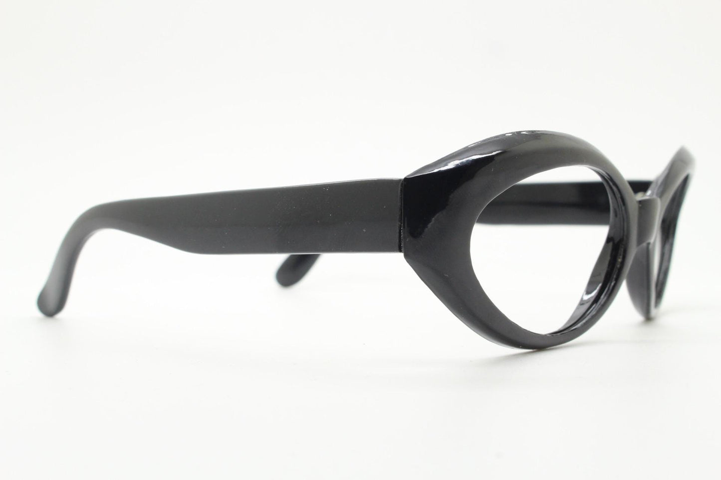 80s vintage oval cat eye glasses. Crop sided dynamic black cateye optical frames. 60s design prescription eyeglasses. RX spectacles. NOS