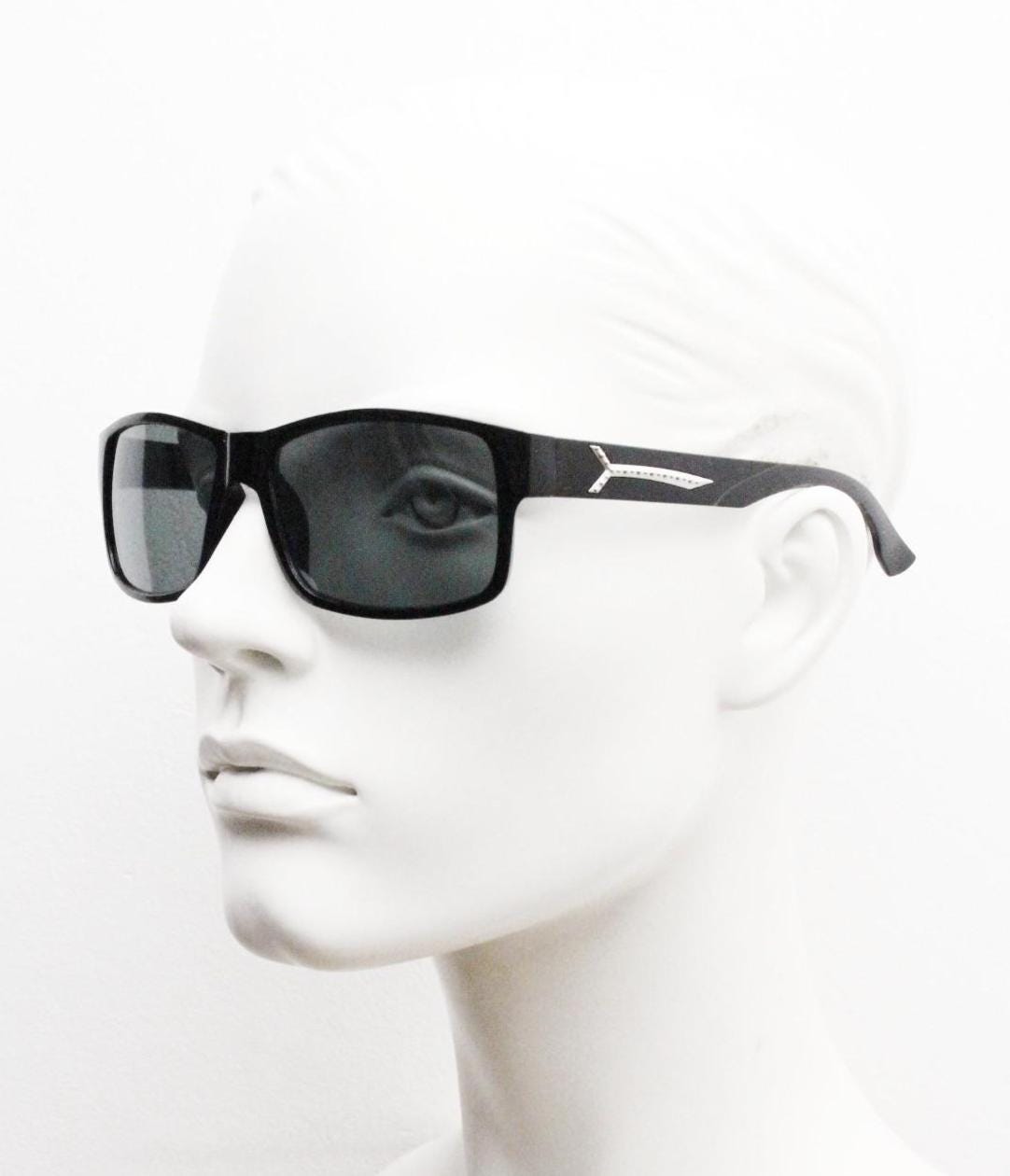 Y2K vintage sharp rectangular sunglasses. Large curved black gloss frame with dark green lenses and silver arrow arm crests. NOS