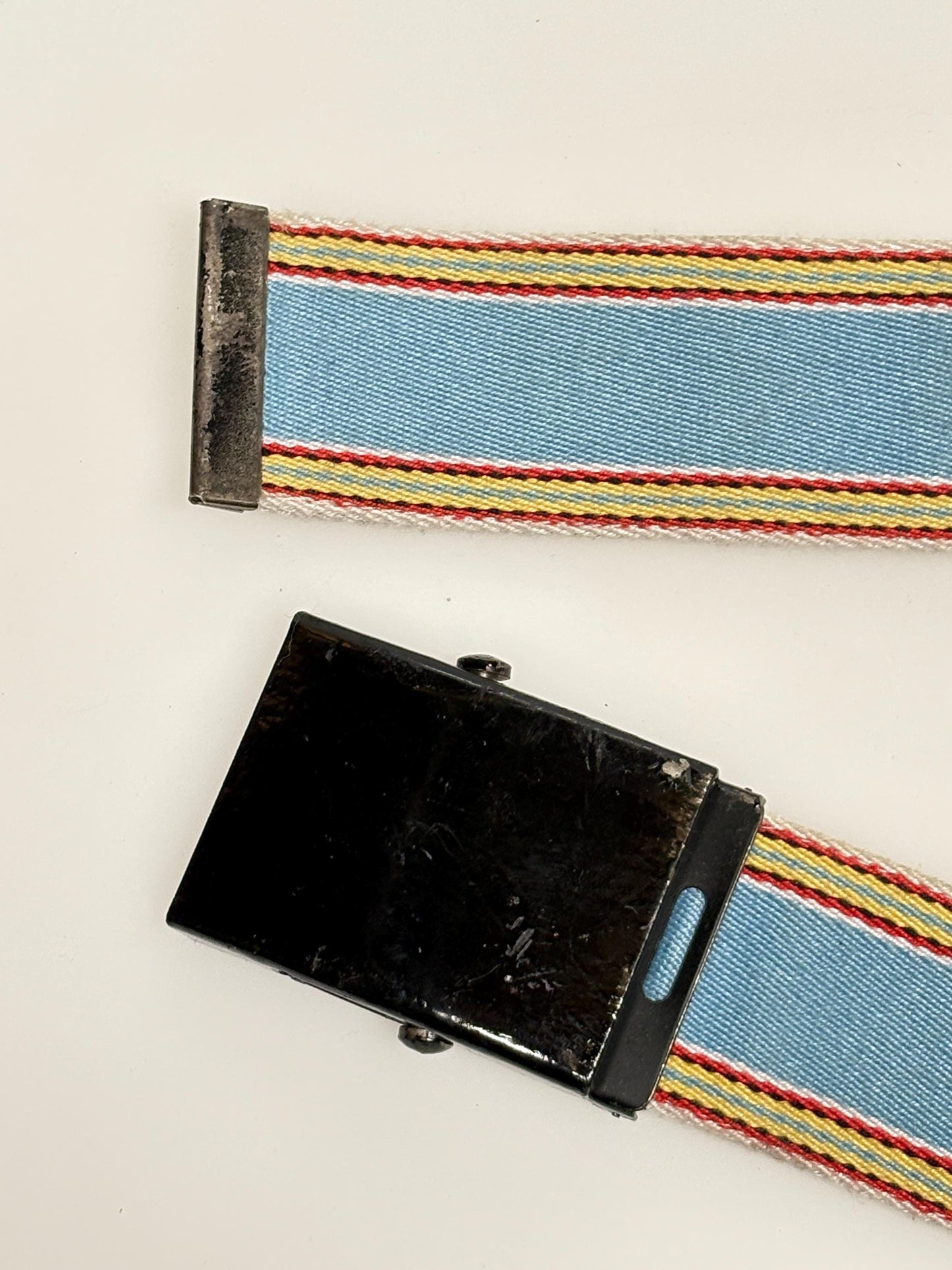 Y2K vintage 2' canvas army style belt in sky blue with red, white and yellow rainbow stripes. 2000s Mens large. Fully adjustable size range