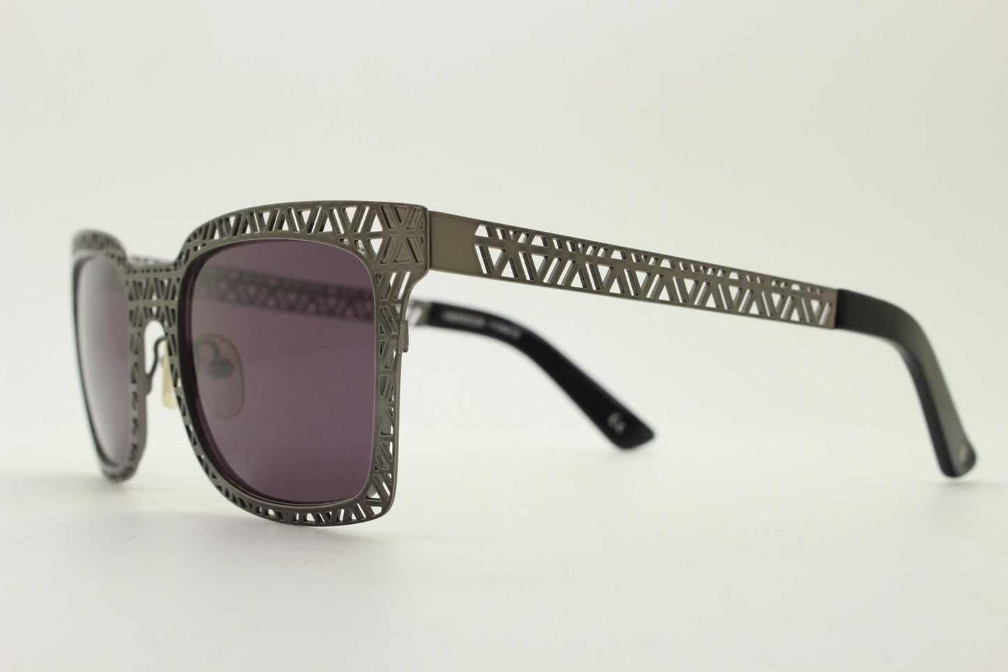 Sass and bide vintage wayfarer shape sunglasses. Gunmetal grey flat metal frame with cut out patterns throughout and black lenses. 2000s NOS