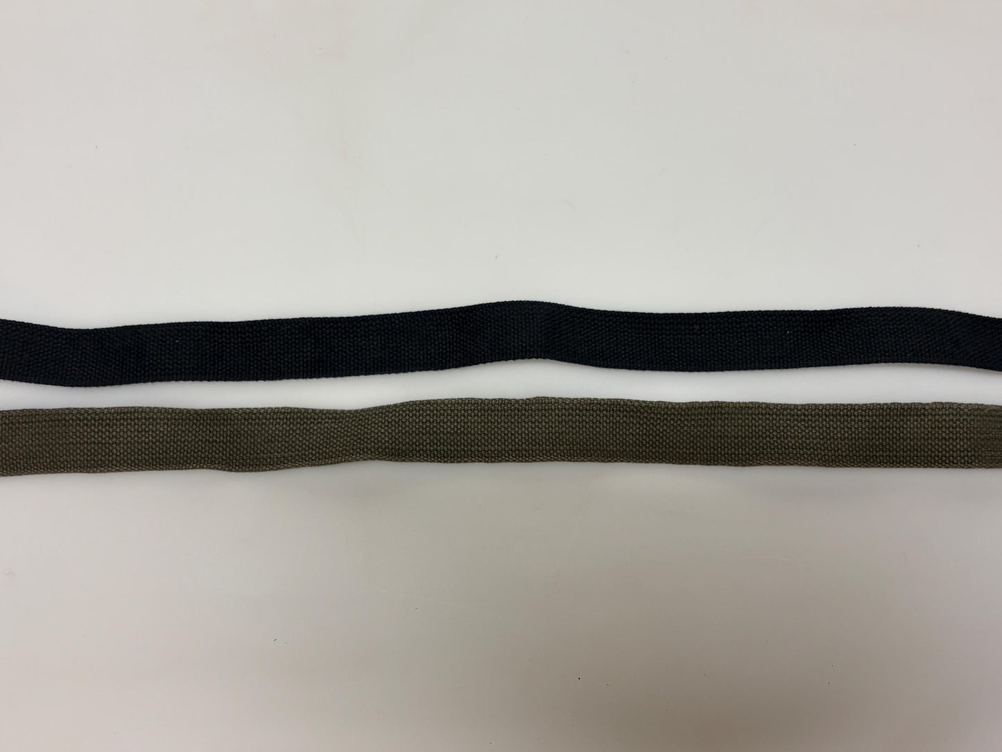 2 x bundle 80s vintage canvas army belts. One black plus one khaki green no holes format. Slide lock gold buckle. Webbing. Fully adjustable