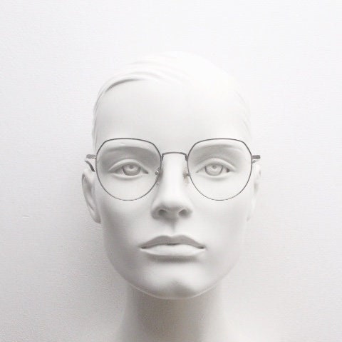 Bolon round panto flat top eye glasses model 7052. Slender silver metal optical frame with black brow. Prescription spectacles. Vintage RX