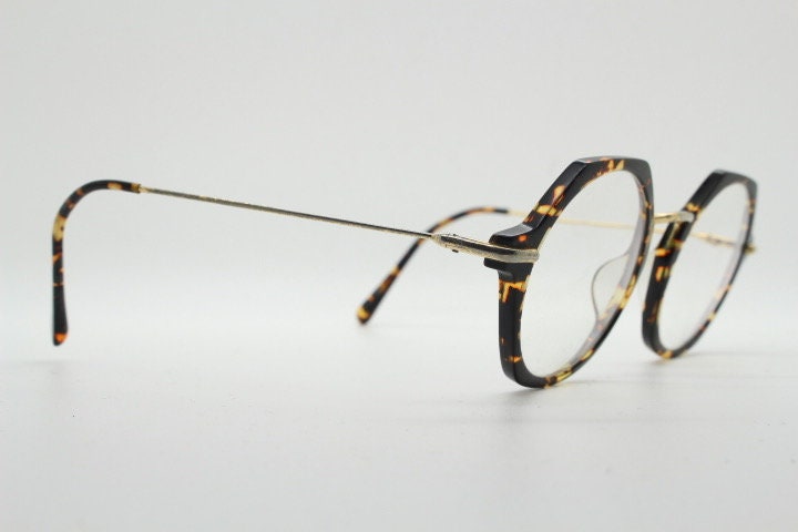 Kaleos hexagon eye glasses model Trevethyn made in Italy. Amber tortoise acetate optical frames with gold arms. Prescription eyeglasses. RX