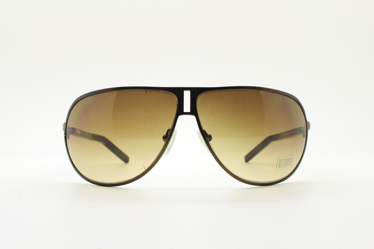 Storm Y2K bug eye aviator sunglasses model Photon. Bronze satin finish shield style aviators with graduating brown lenses.  Unused NOS.