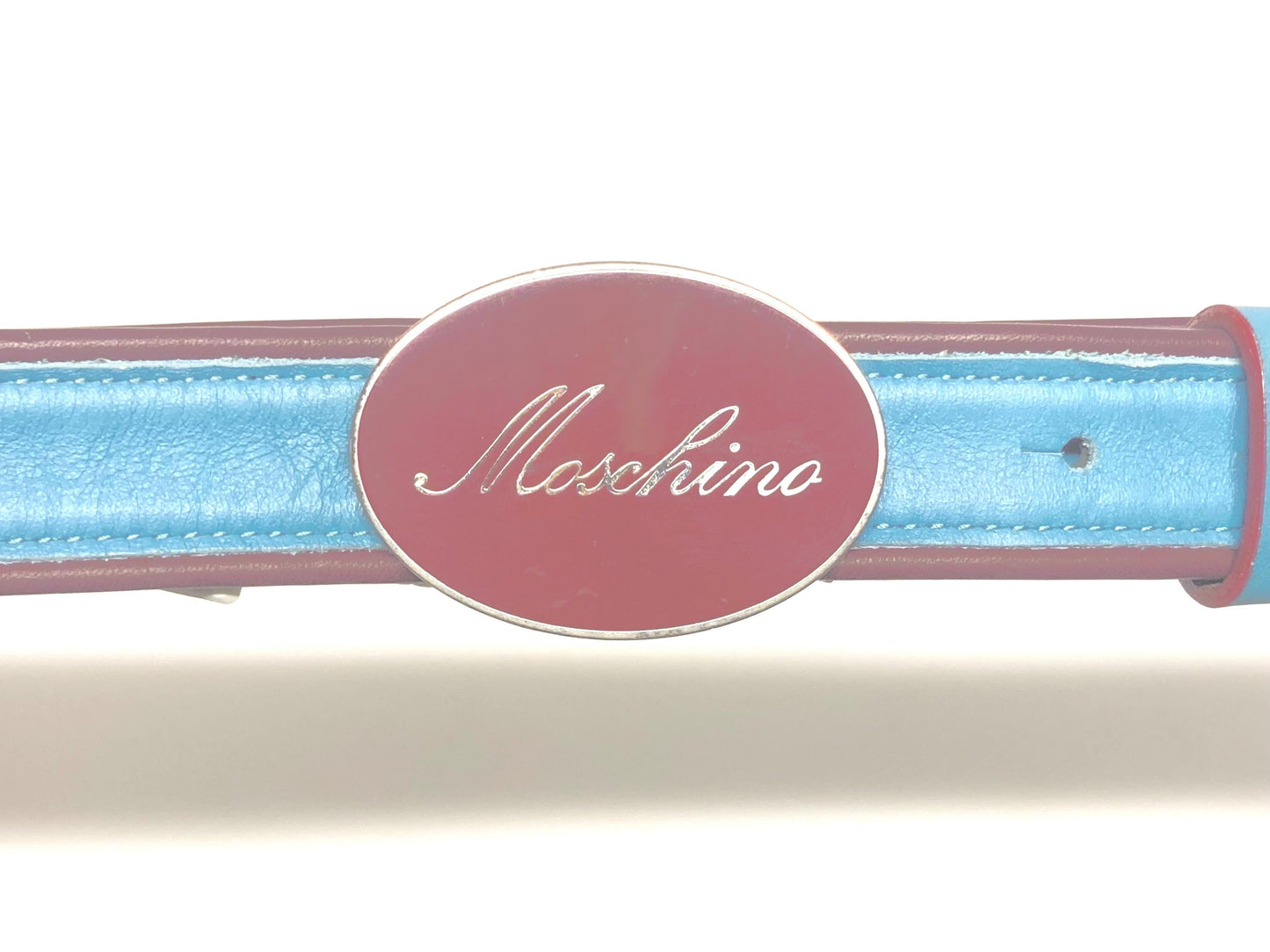 Moschino 90s vintage womens dress belt in oxblood and blue genuine leather with oval enamelled metal buckle. Made in Italy. BNWT. NOS