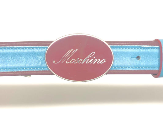 Moschino 90s vintage womens dress belt in oxblood and blue genuine leather with oval enamelled metal buckle. Made in Italy. BNWT. NOS