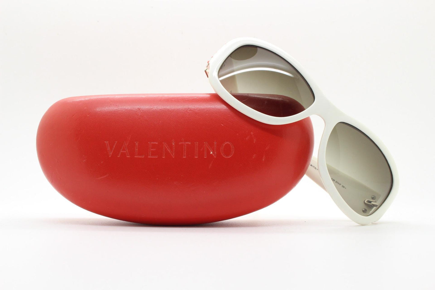 Valentino Y2k vintage wrap around bug eye sunglasses. Curving white acetate shield frame with orange and diamante stones. 2000s. Rhinestone