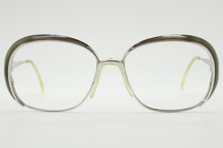 Christian Dior 70s vintage big round eye glasses made in Austria. Silver optical frame with dynamic reflective grey enamel. Prescription RX