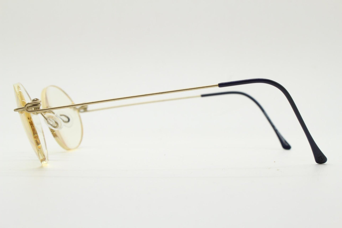 TRY vintage oval frameless eye glasses made in Italy. Futuristic minimal lightweight gold titanium optical frame. RX Spectacles