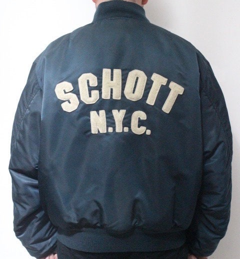 Schott NYC vintage reversible bomber jacket. Big spell out logo back in blue with red reverse side featuring white eagle. Flying MA 1.
