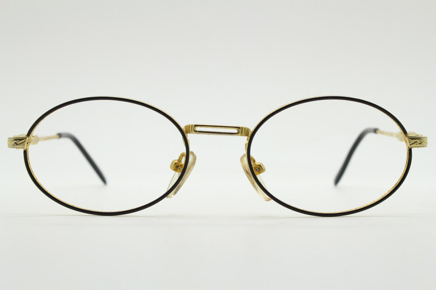 90s vintage small oval eye glasses. Gold and black optical frames with ornate arm details. Prescription RX steampunk spectacles. NOS