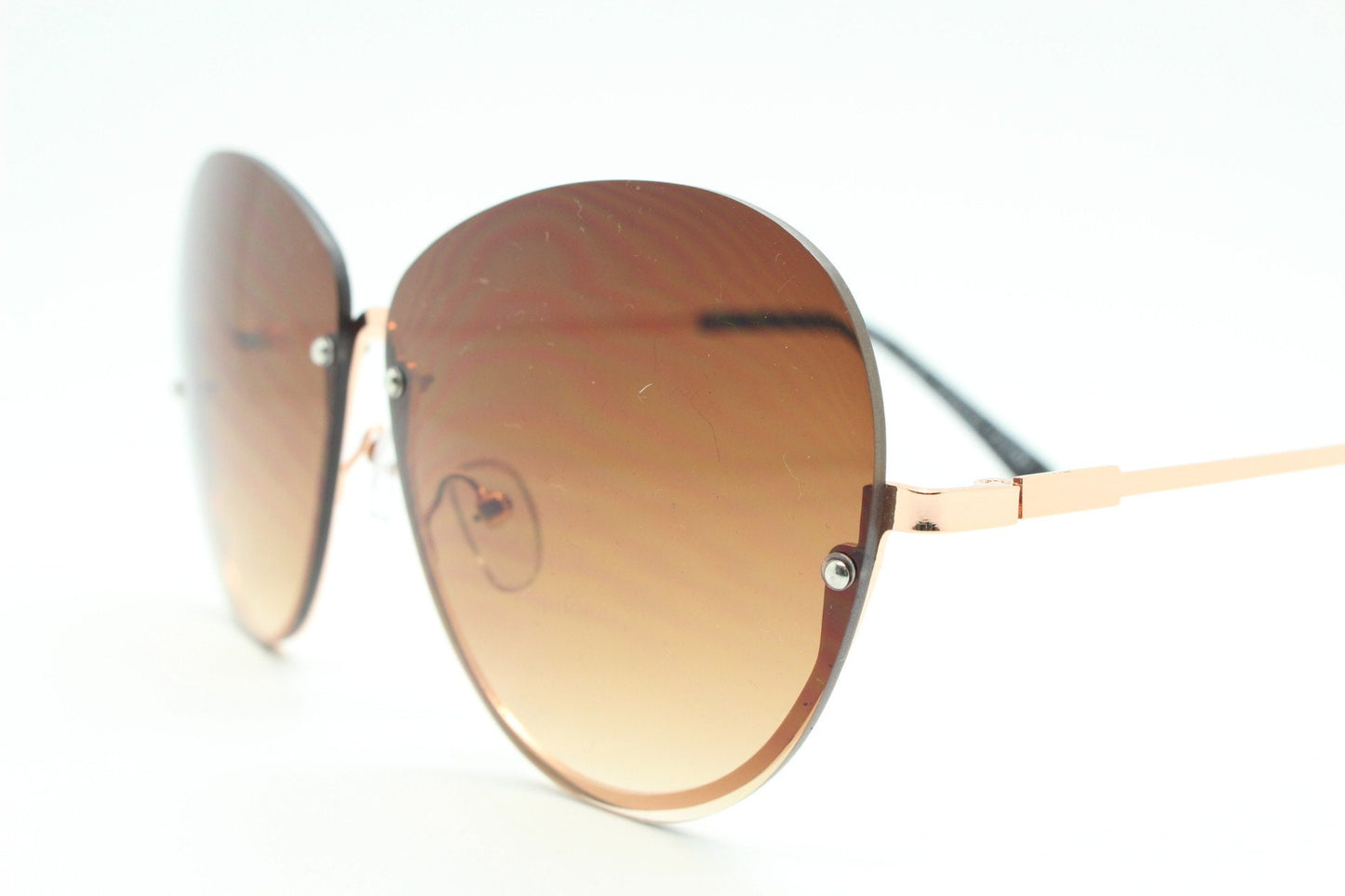Y2K vintage large rimless sunglasses. Women's 70s style half frame design with graduating brown lenses and gold arms. 2000s BNWT