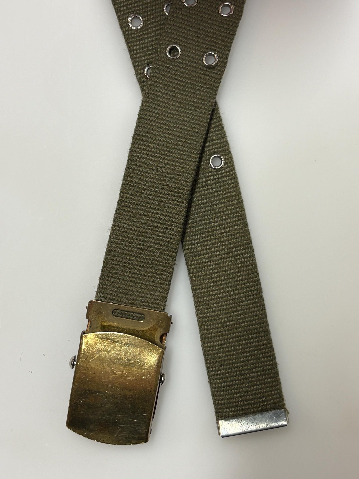 90s vintage canvas army style belt. Khaki green with 2 rows of silver metal holes. Slide lock gold buckle. Webbing. Fully adjustable