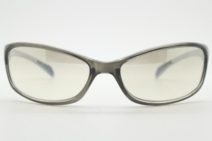 Y2K vintage futuristic sunglasses. Gloss white and grey wrap around shield style frame with light tone lenses. Cosplay visor. 2000s NOS
