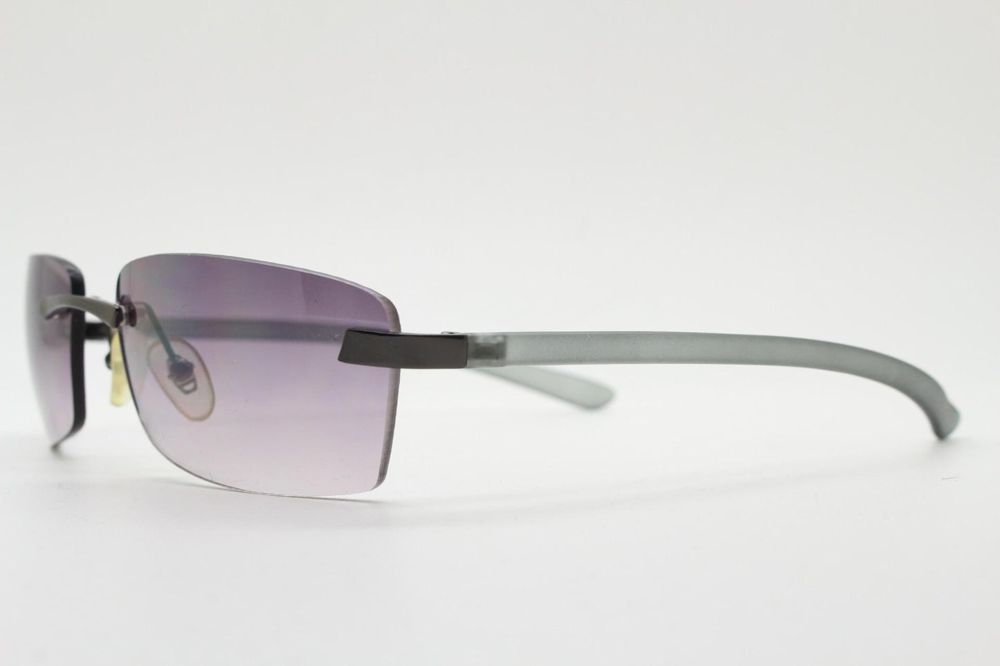 90s vintage minimal frameless sunglasses. Minimal mulberry rectangular lenses with gunmetal grey trim and frosted arms. Matrix shades