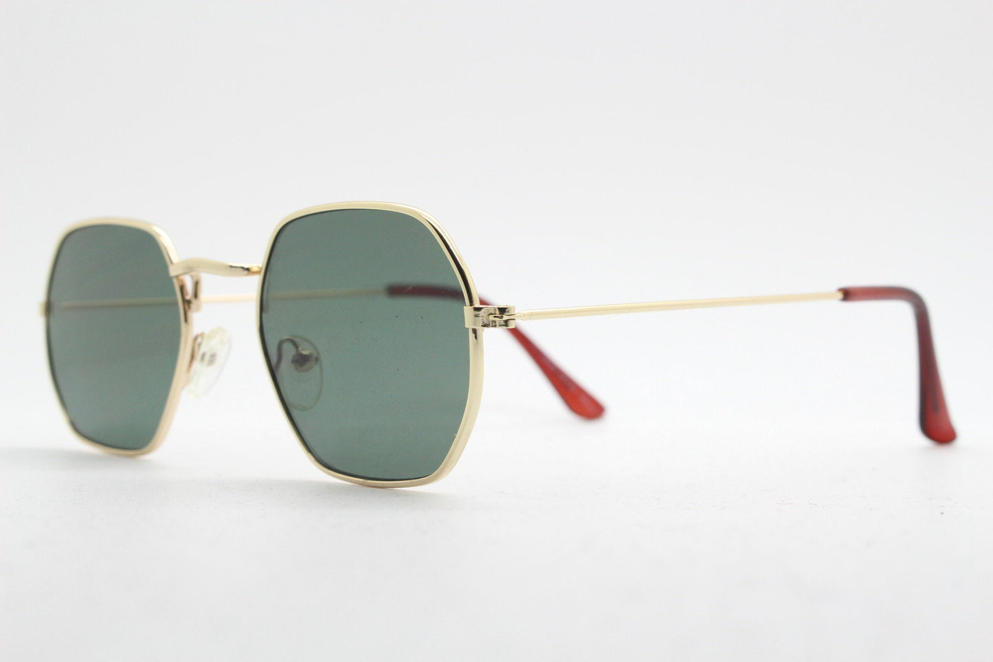 90s vintage hexagon sunglasses. Low profile slim gold 60s design frame with flat green lenses Octagon