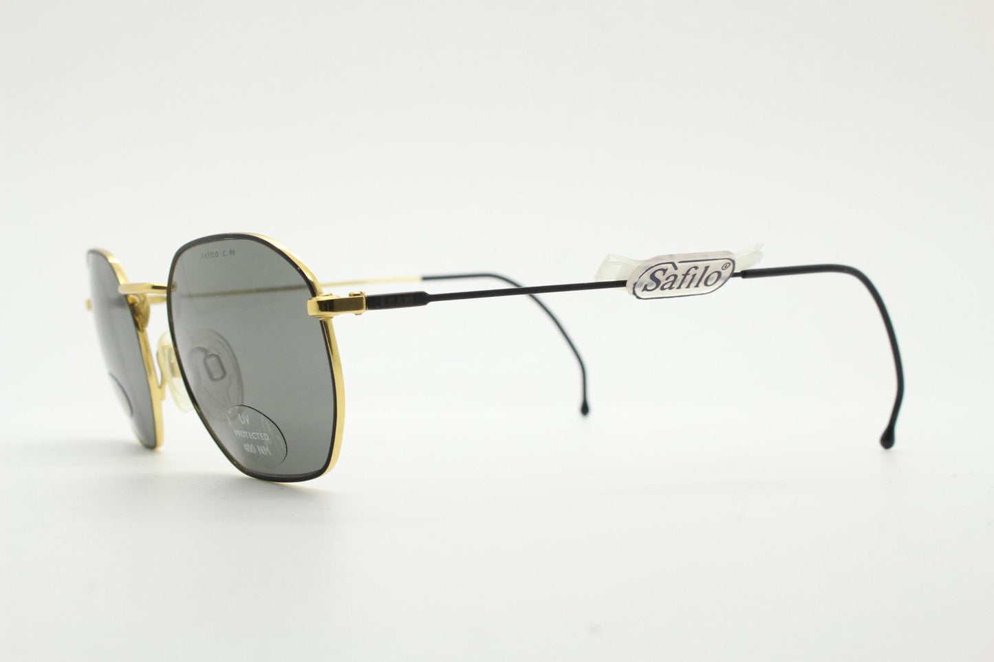 Safilo 90s vintage angled rectangular sunglasses made in Italy. Flexible black wire  metal frame with gold trim and green lenses. BNWT NOS