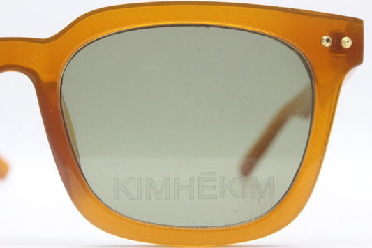 KIMHEKIM oversized wayfarer design sunglasses model J00\2. Transparent amber acetate chunky frame with 2 logo green lenses. BNWOT