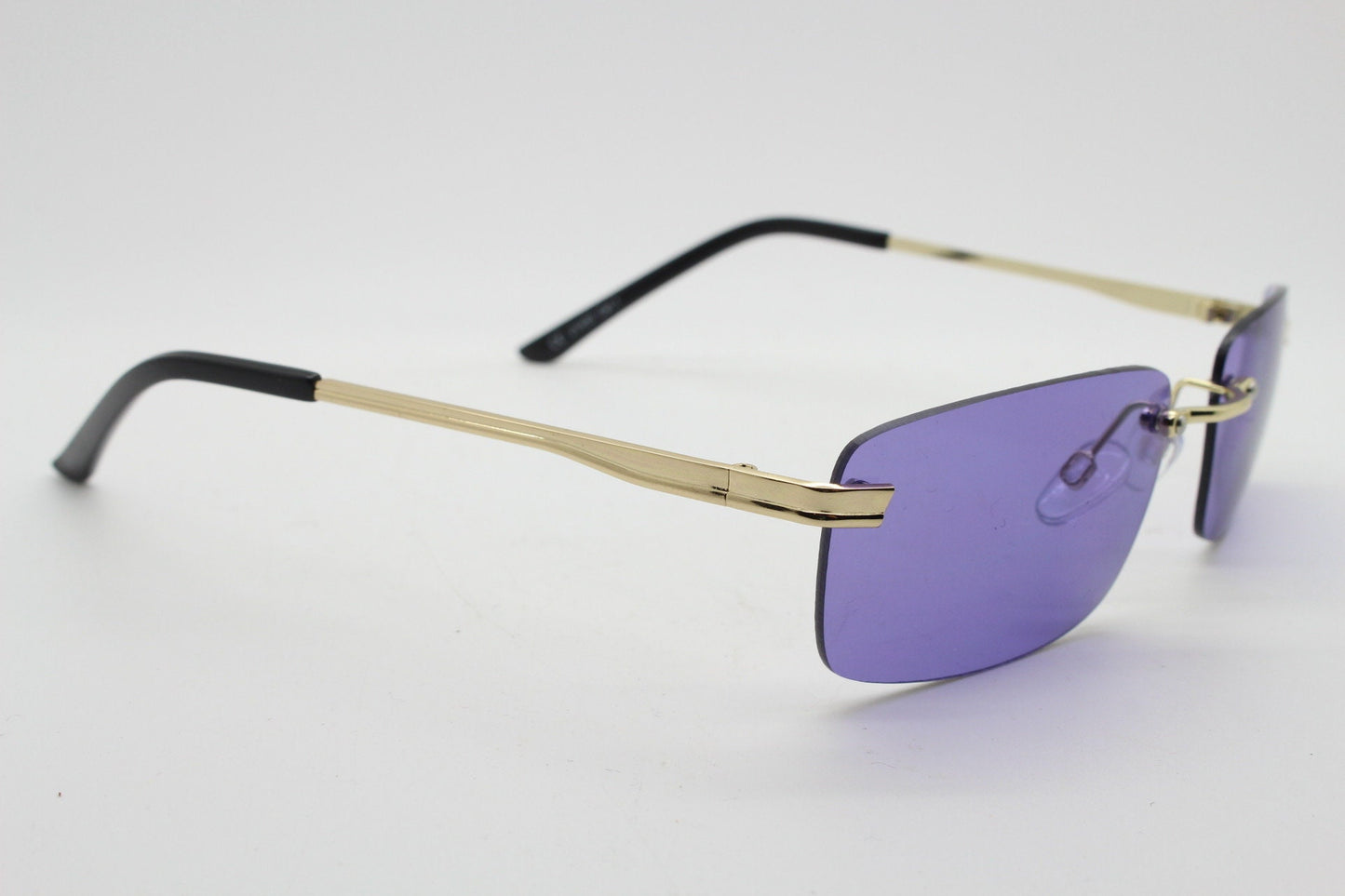 Y2K vintage frameless purple sunglasses. Rectangular lenses with gold bridge and arms. 2000s club kids. 00's. 90s Rave