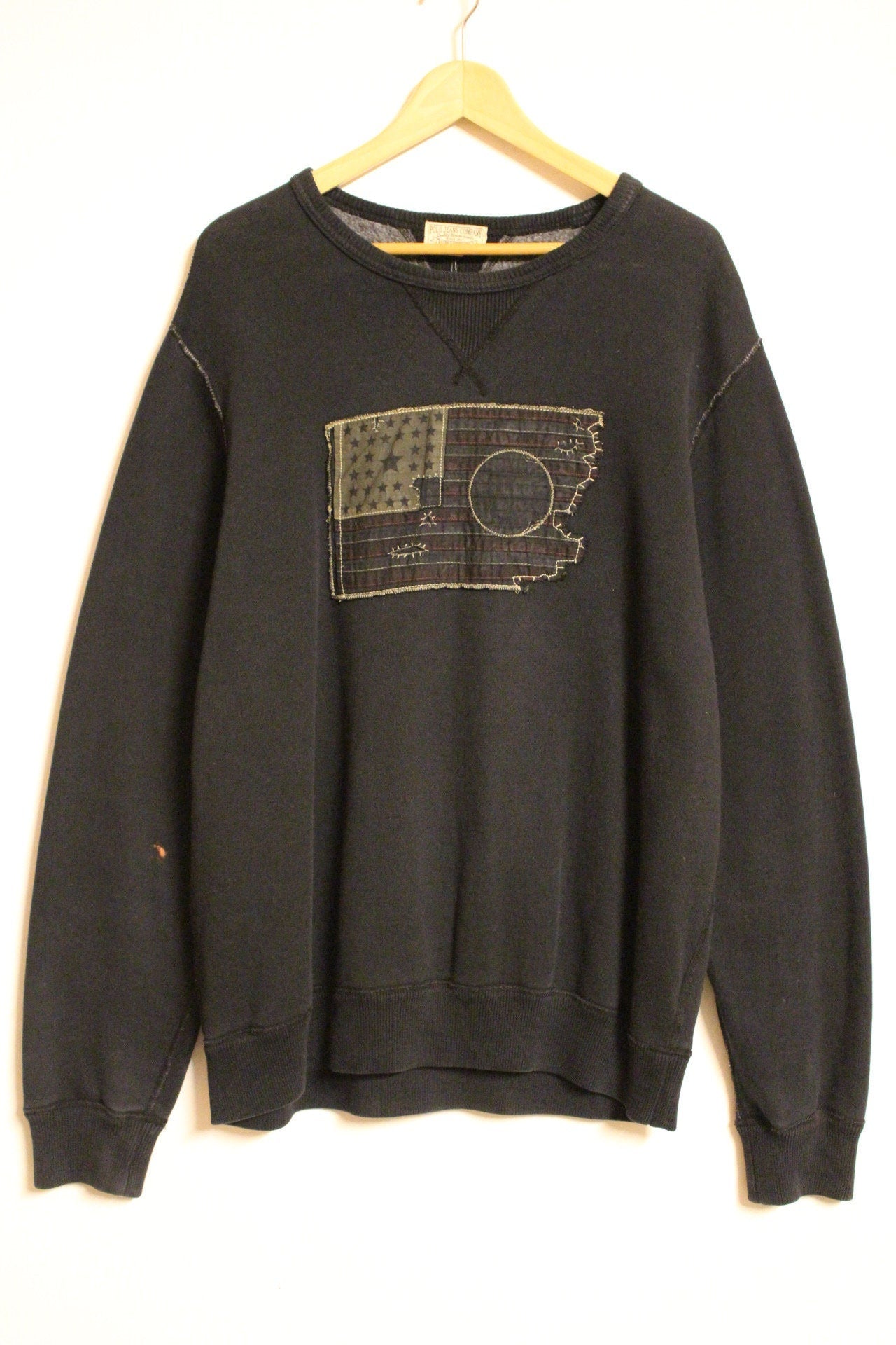 Ralph Lauren Polo Jeans Co. vintage sweatshirt. Black crew neck pullover with distressed US flag patch. Round neck jumper