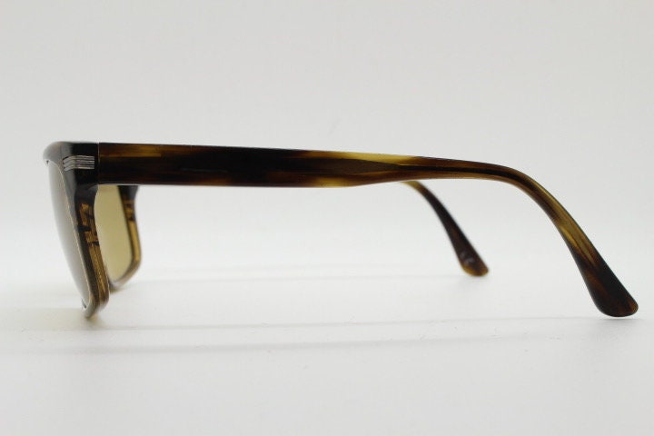 Oliver Peoples vintage rectangular sunglasses model Maceo. Handsome transparent mottled honey brown acetate frame with mid tone lenses