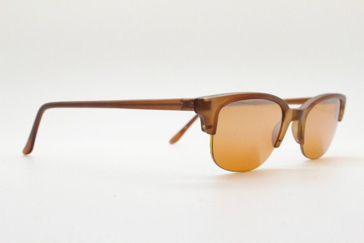 90s vintage low profile cat eye sunglasses. Transparent half frame cateye with matching mirror glazed light tone lenses. NOS
