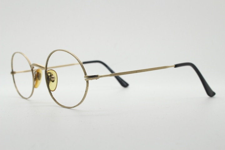 Giorgio Armani 90s vintage oval eye glasses made in Italy. 30s design gold optical frames in a satin finish. Prescription RX